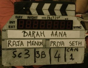 The slate of the film Barah Aana