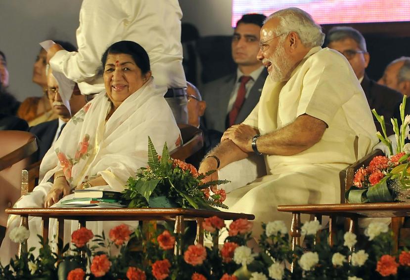 BJP prime ministerial candidate Narendra Modi felicitates singer Lata Mangeshkar on completion of 51 years since the singing of song  ``Ae Mere Vatan Ke Logo`` in Mumbai on Jan. 14, 2014.  (Photo : Sandeep Mahankal/IANS)