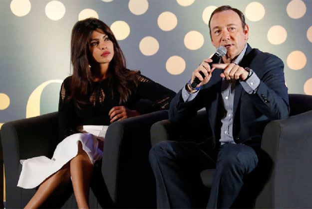 Priyanka Chopra and Kevin Spacey interacting with journalists sitting atop a stage. This is another popular way of dispensing interviews where all the journalists are made to sit with the "audience" and a mike is passed around for them to ask questions. Usually. no journalist subject is allowed to ask more than one question.