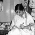 Lata signing an autograph